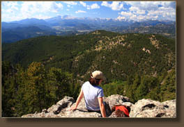 Andra and Makenzie on Crosier Mt with Estes Park and Longs Peak in the distance