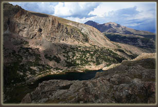 Cliffs of Mahana Peak over Bluebird Lake